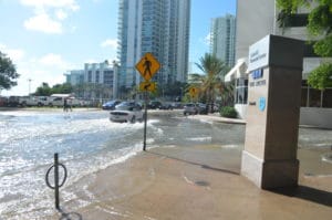Water covering street and sidewalk