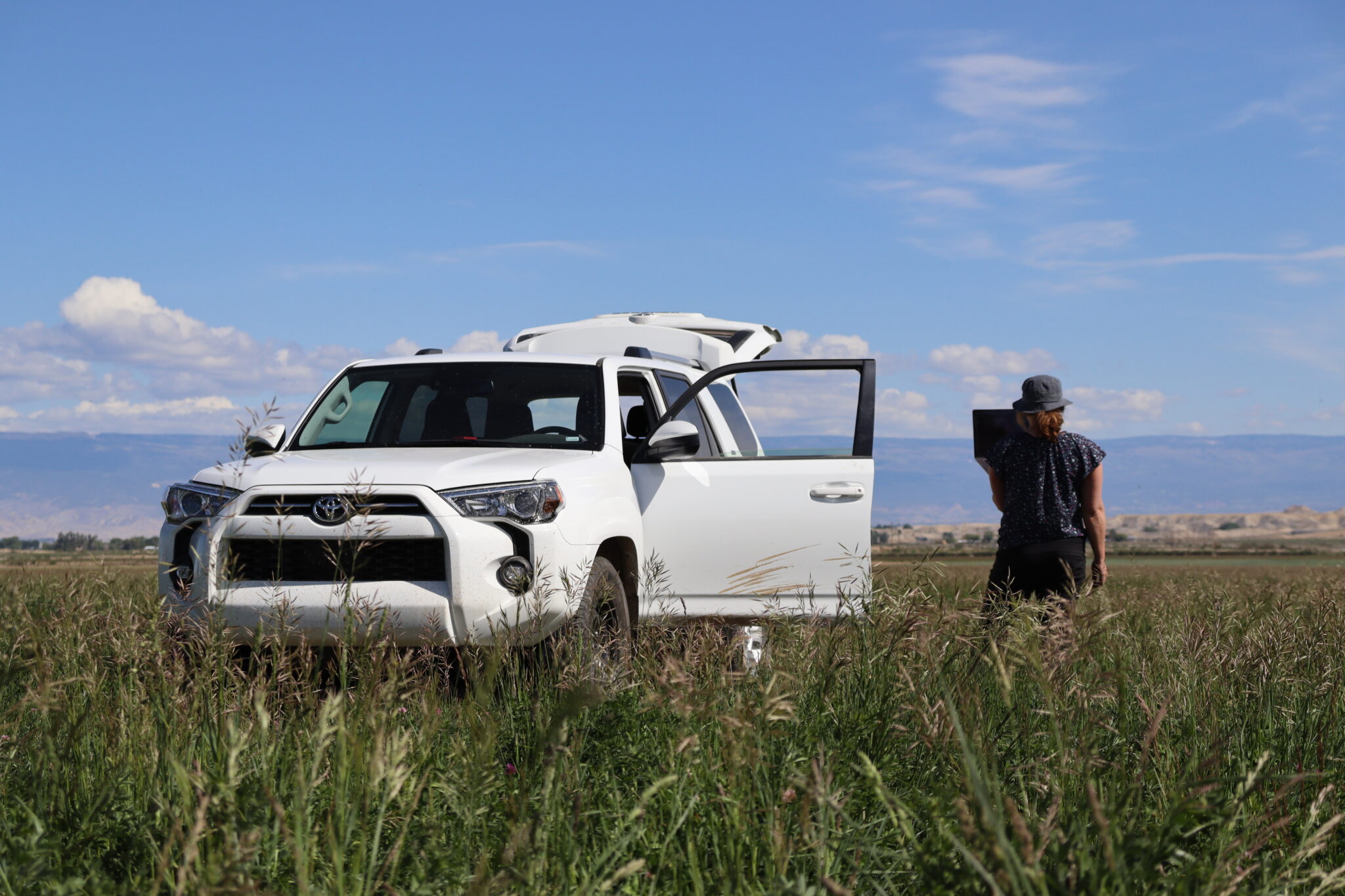 dr watts delivers a presentation from the middle of a colorado pasture