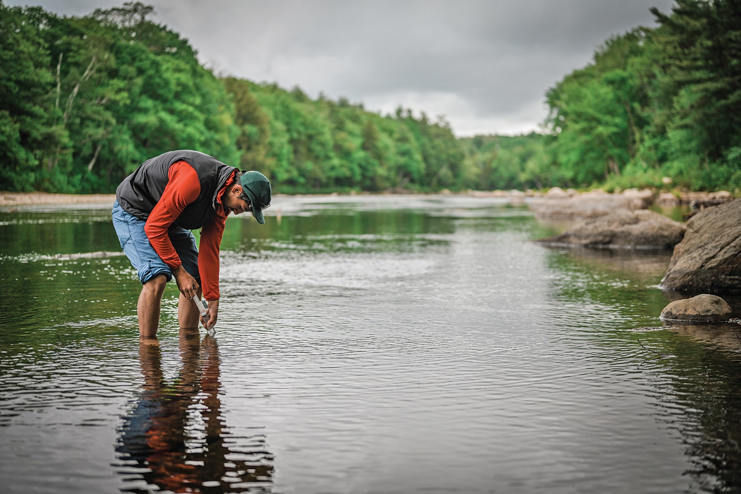 Science on the fly volunteer collects a sample