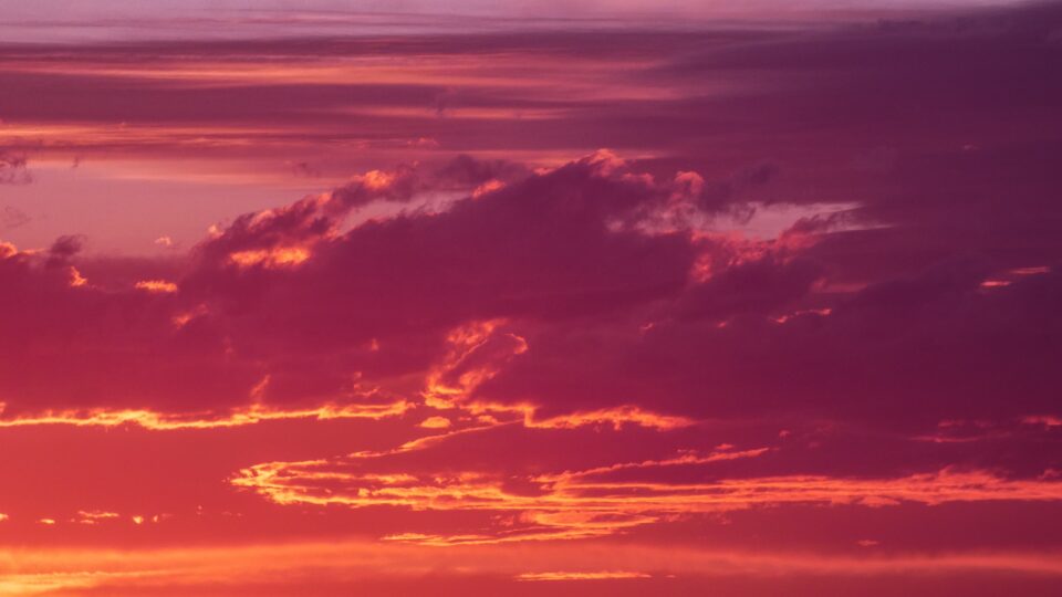A vivid pink and orange sunset