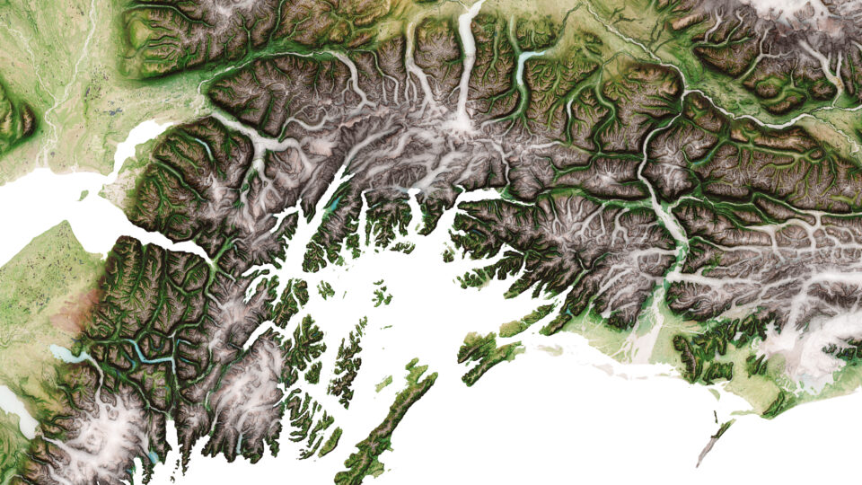 A close-up of a colorful, detailed topographical map of Alaska
