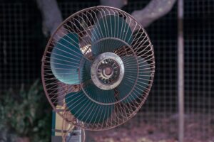 A rotating fan with blue blades