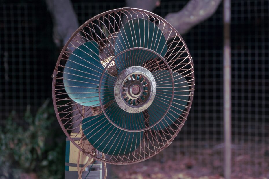 A rotating fan with blue blades