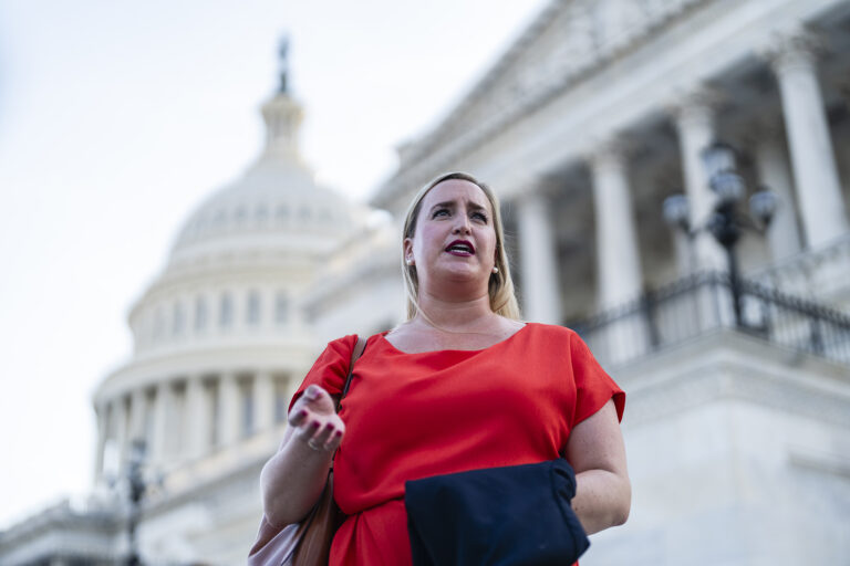 Laura Uttley speaking in front of the us capitol building