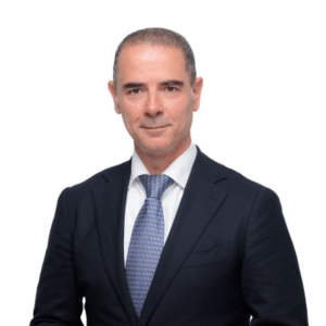 Portrait photo of Kaveh Guilanpour wearing a black suit and blue tie