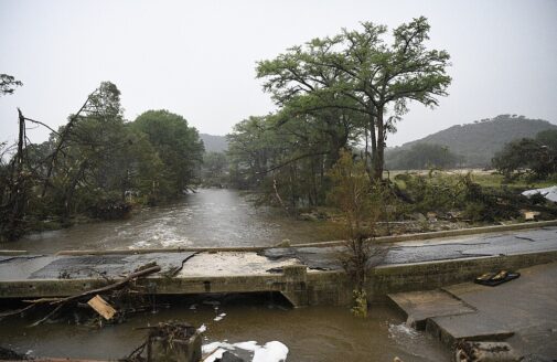a bridge road in Texas damaged by flooding
