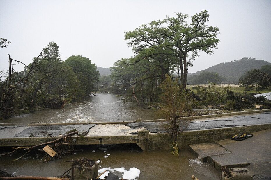 a bridge road in Texas damaged by flooding