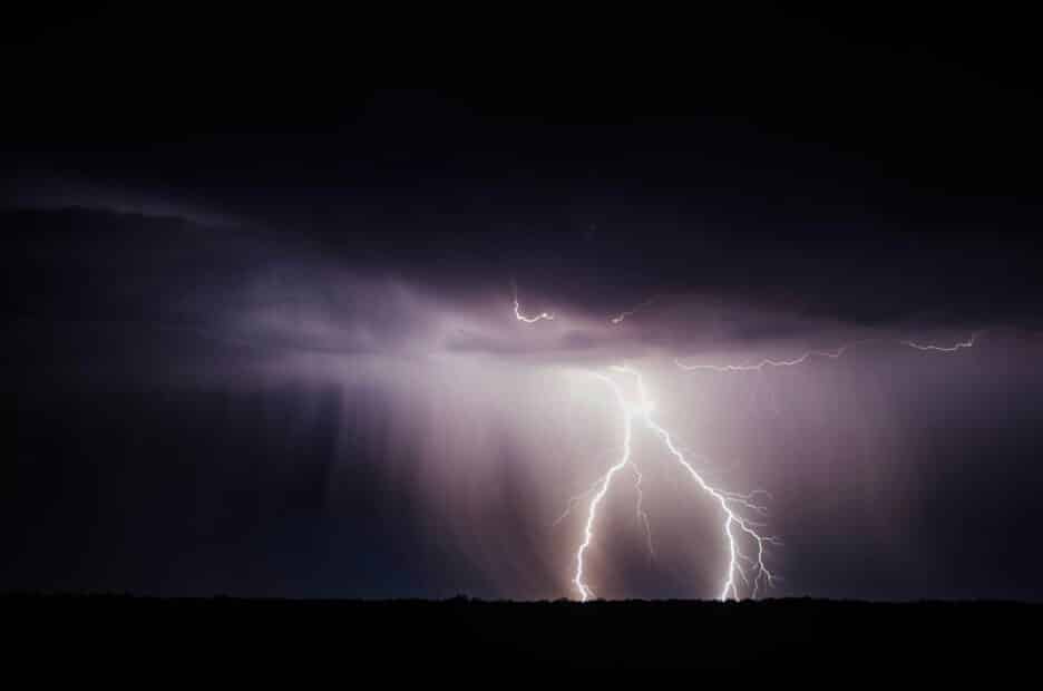 lightning lights up a dark stormy sky