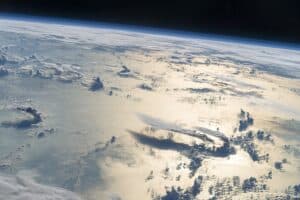 view of Earth from space, over the Philippine Sea, showing clouds over water