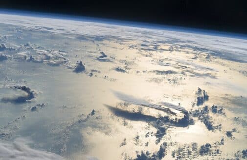 view of Earth from space, over the Philippine Sea, showing clouds over water