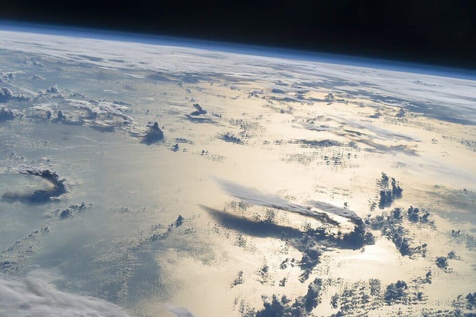 view of Earth from space, over the Philippine Sea, showing clouds over water