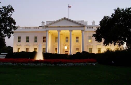 the white house with a fountain in front