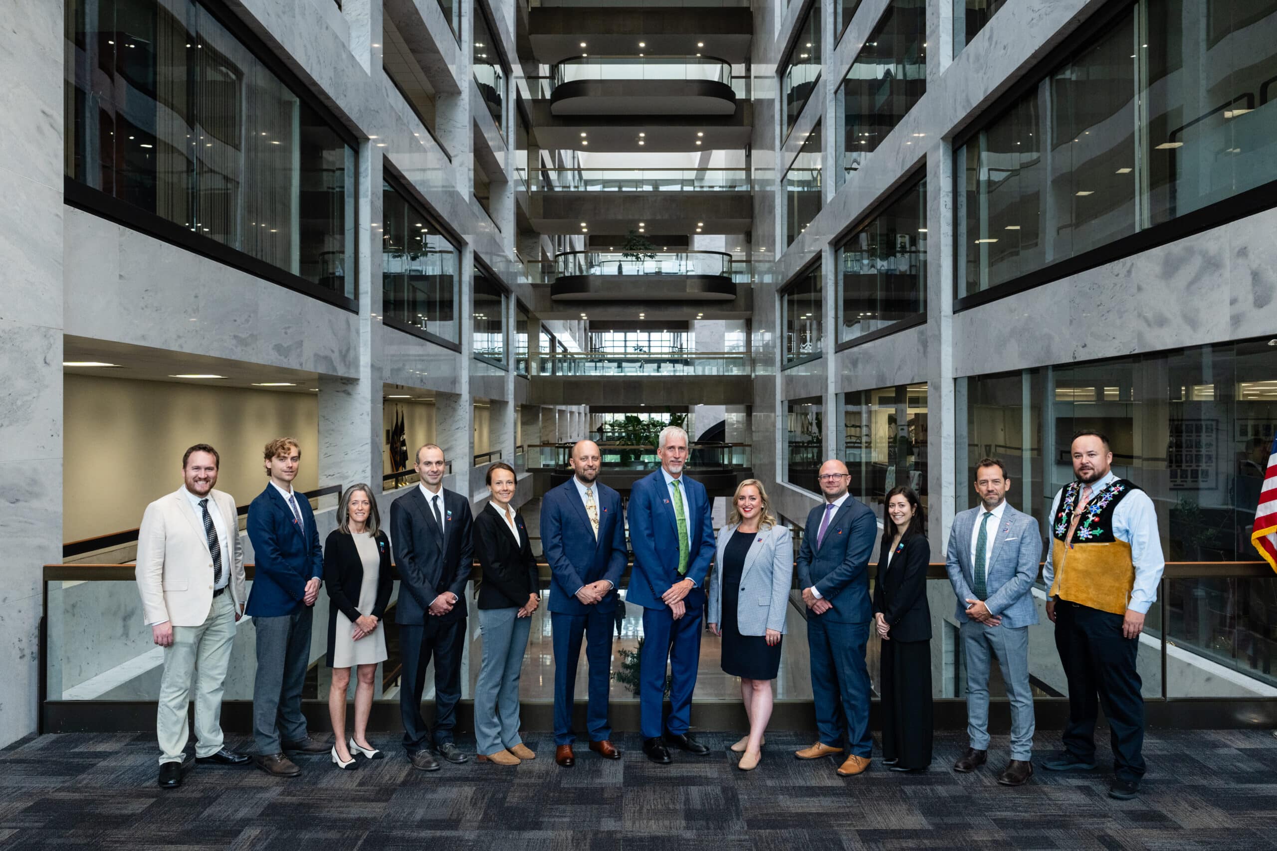a group of scientists and policy experts from woodwell stand for a posed picture