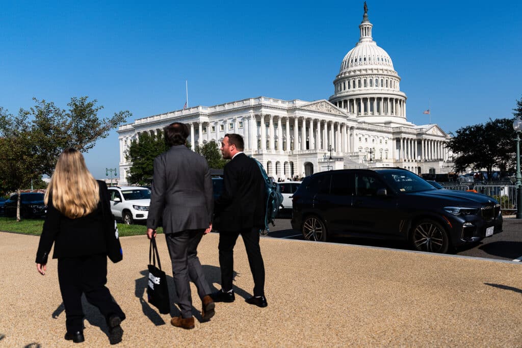 members of woodwells fly in walking in front of the capitol building