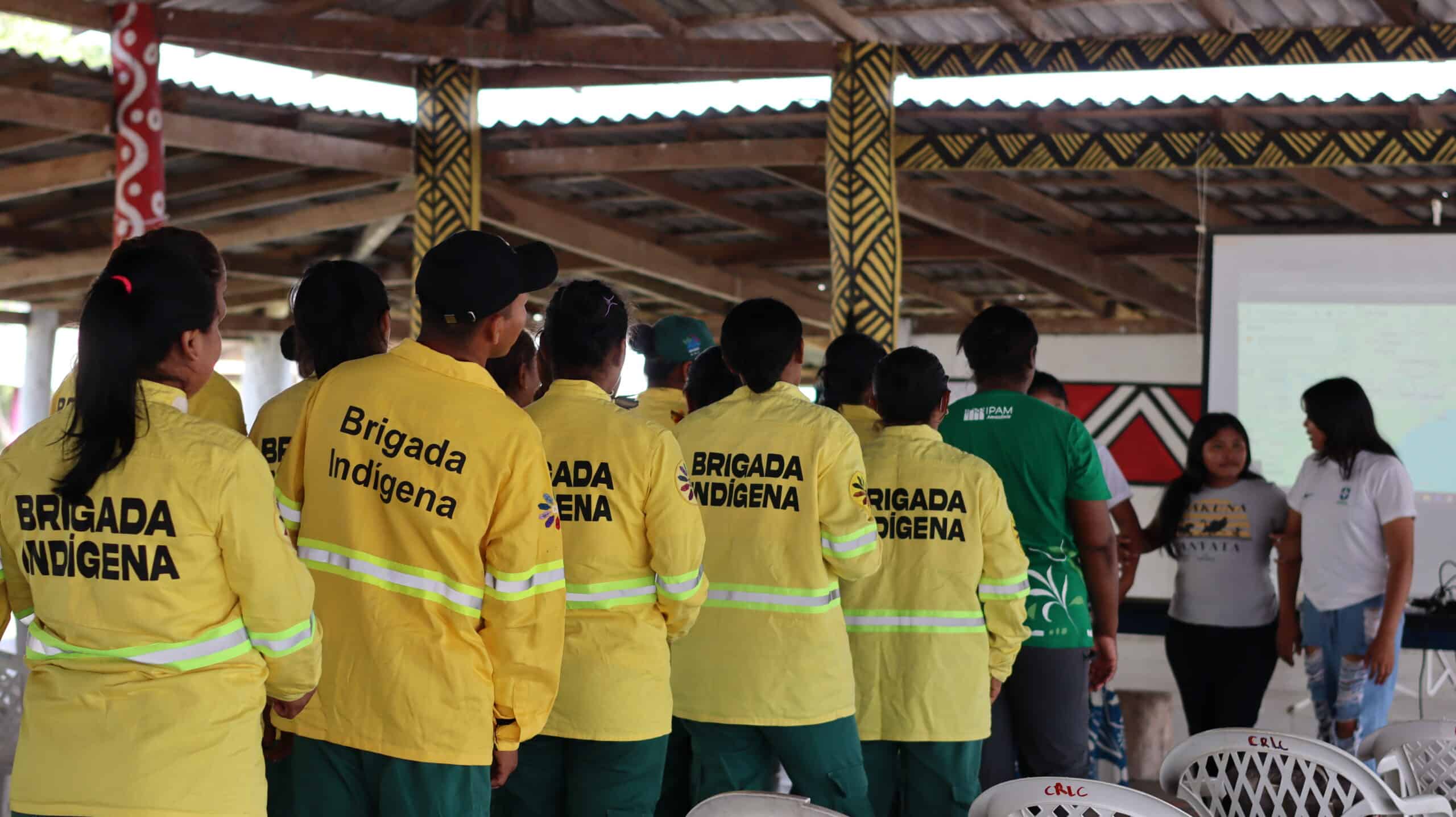women and men in their brigade uniforms line up during the workshop in roraima