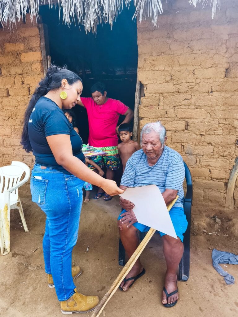 a womens brigade member shares a calendar with a community member