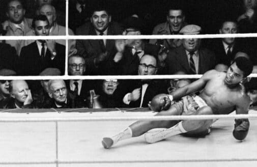 Cassius Clay (Muhammand Ali) floored on the canvas during the 1963 bout with Henry Cooper.