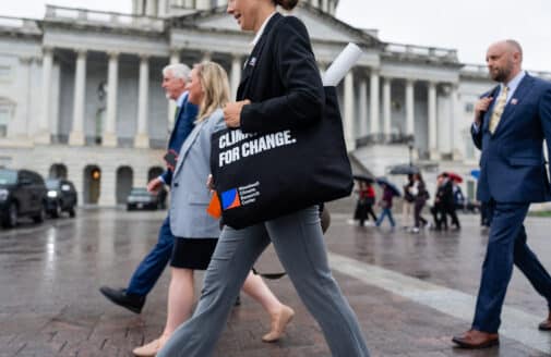 Woodwell experts walk in front of government building in Washington DC