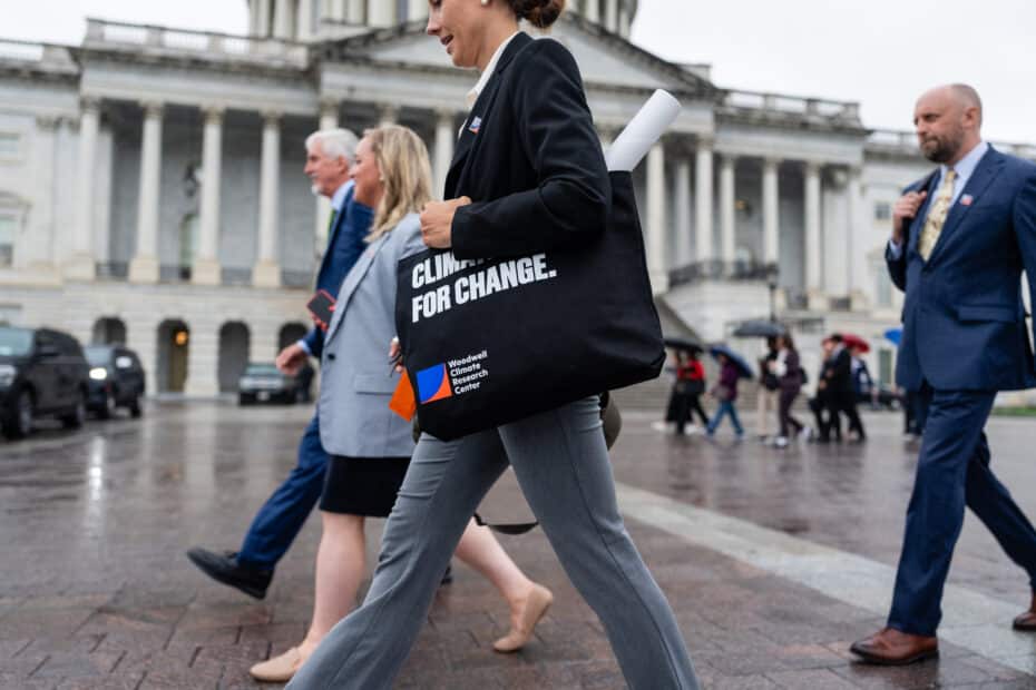 Woodwell experts walk in front of government building in Washington DC